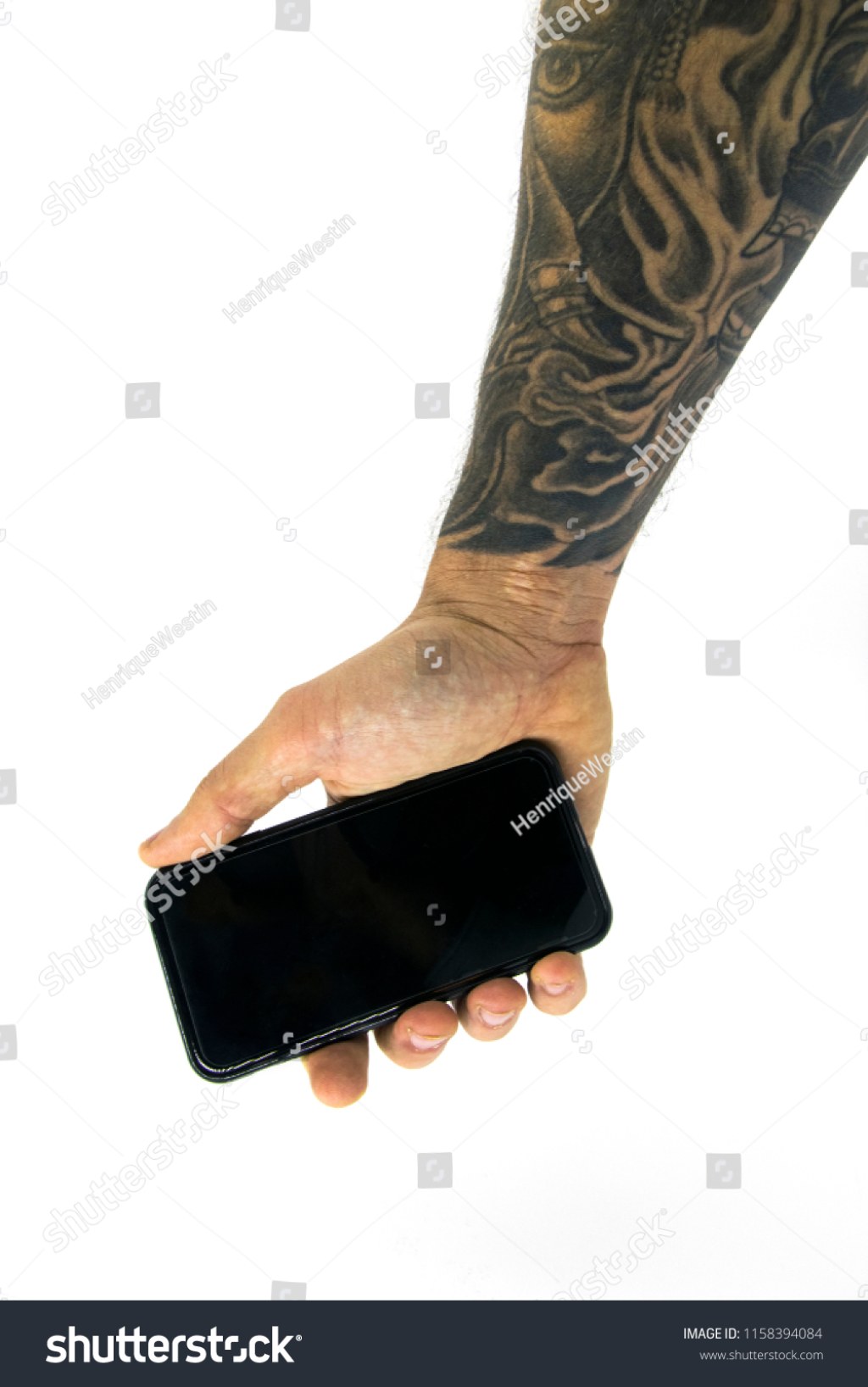 Picture of: Upside Down Hand Holding Smart Phone Stockfoto